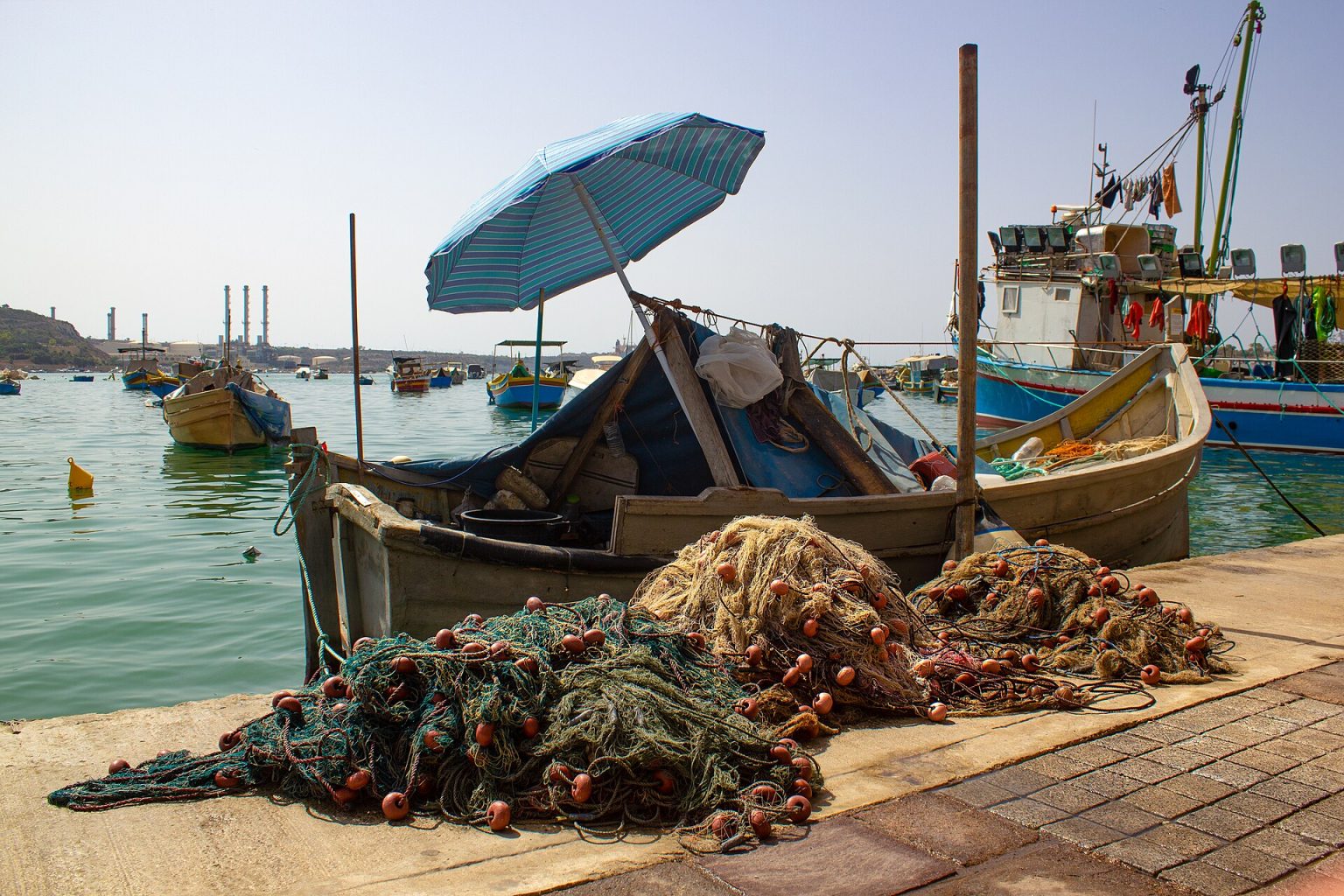 A working fishing boat with nets in Gulf waters