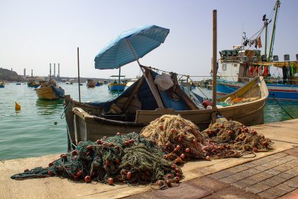 A working fishing boat with nets in Gulf waters