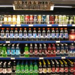 Supermarket shelves with packaged foods and nutrition labels being examined